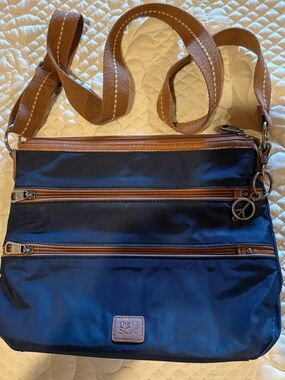 The Sak Esperato Nylon Crossbody Bag navy blue contrasting brown trim